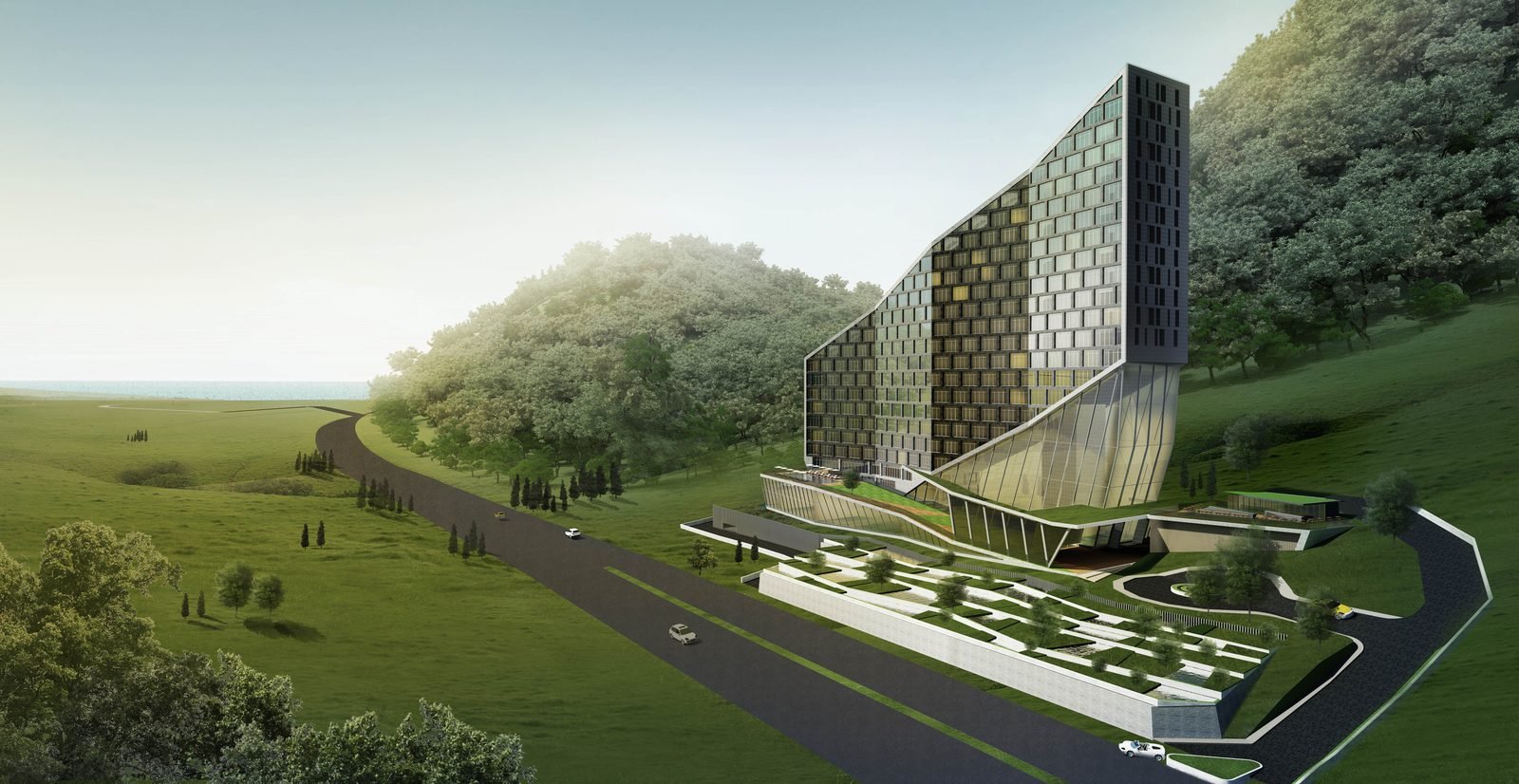 Aerial view of stepped building on forested hillside